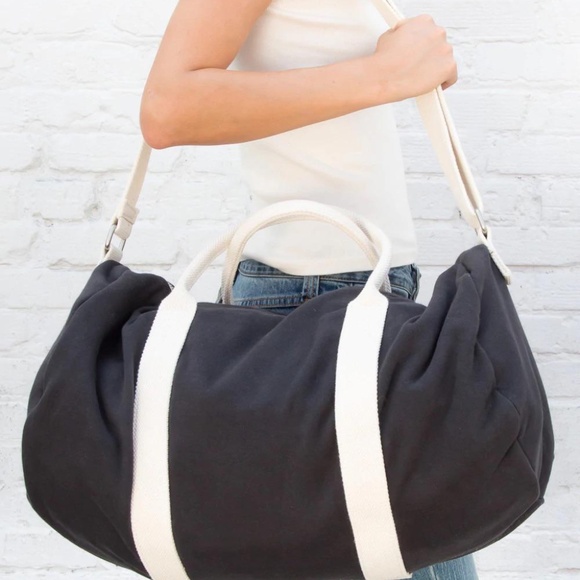 Brandy Melville Handbags - NEW Brandy Melville John Galt Black White Duffle Bag Crossbody Duffle